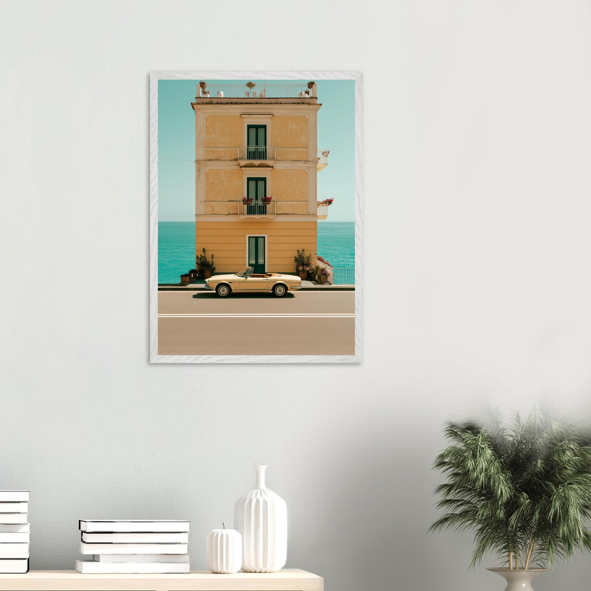 Amalfi Alfa Romeo Spider framed print on a pale wall above a shelf